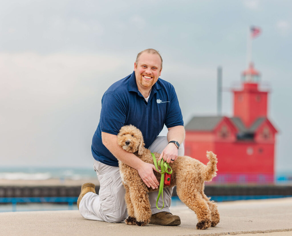 Dog trainer in Grand Haven MI working with dog at Holland State Park
