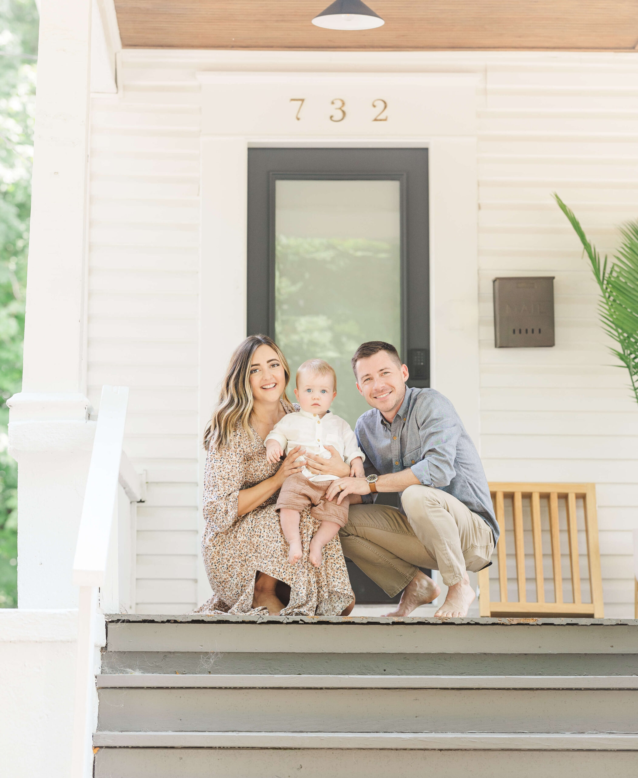 Family sitting on front porch of home in Grand Haven Michigan representing in-home dog training environment