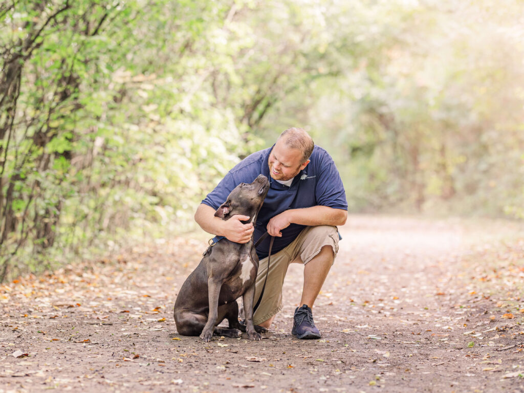 Dog training in Grand Haven MI with a dog practicing calm focus on a wooded trail